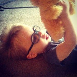 looking at his teddy bear